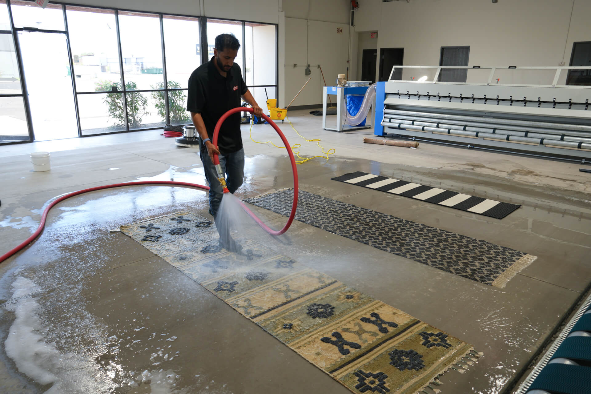 Professional rug cleaning at phoenix rug cleaning facility washing three flat weave runners